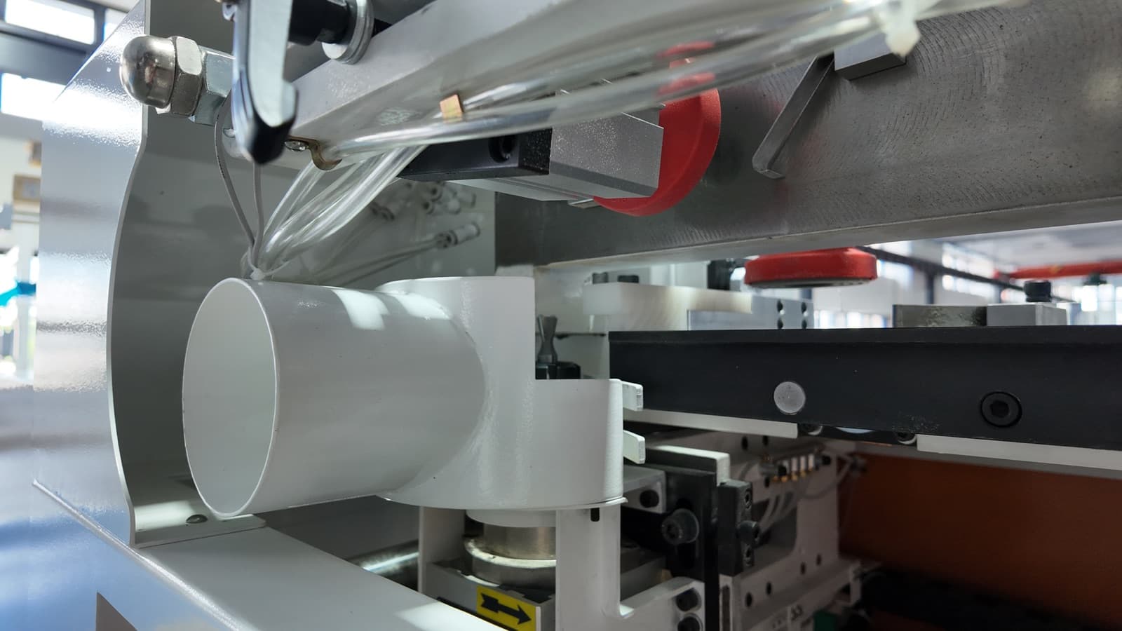 Close-up of the machine's 4-inch dust collection port