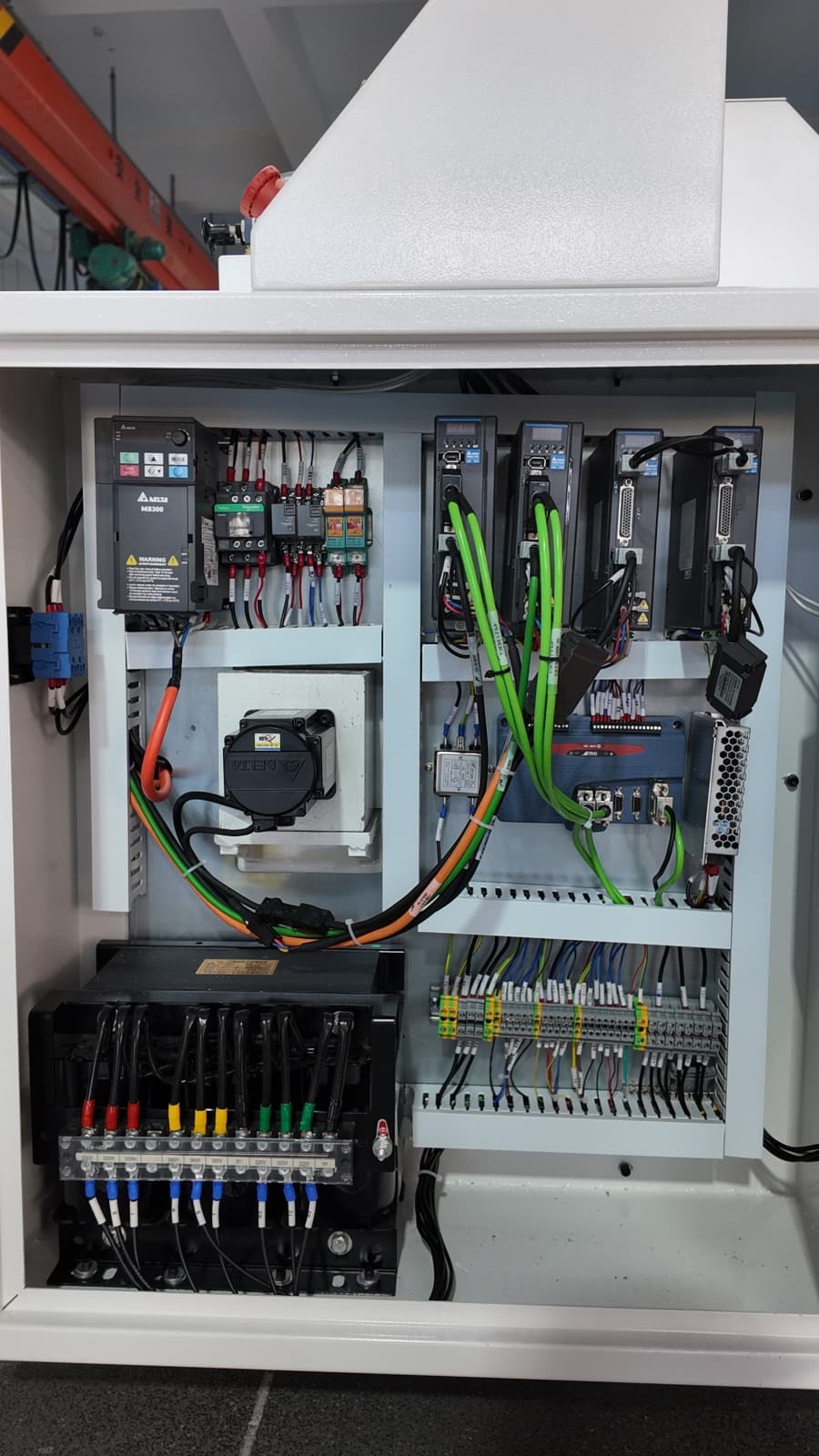 Interior view of the electrical control cabinet and servo drives