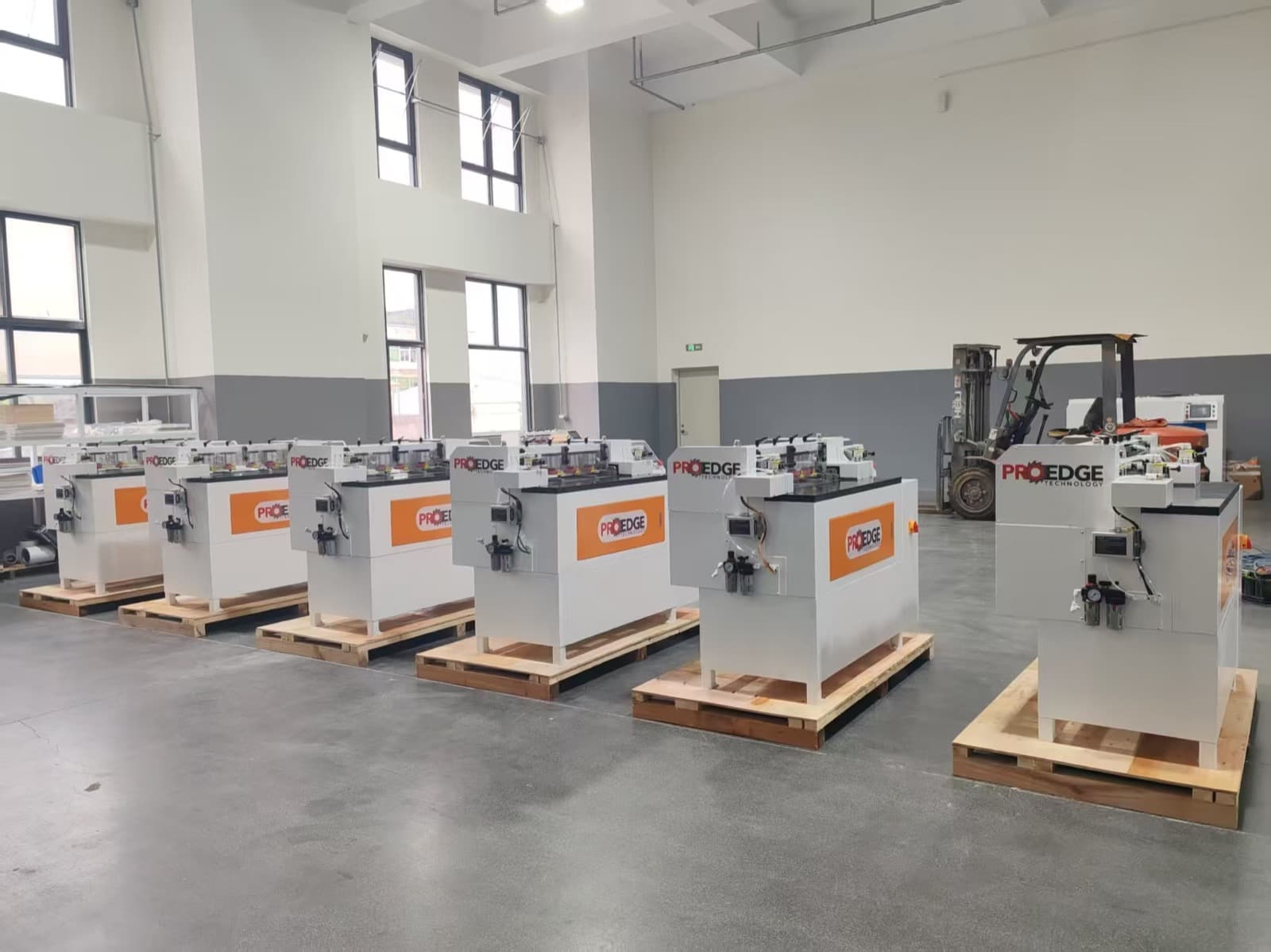 Row of CNC Dovetail machines staged in the factory production area