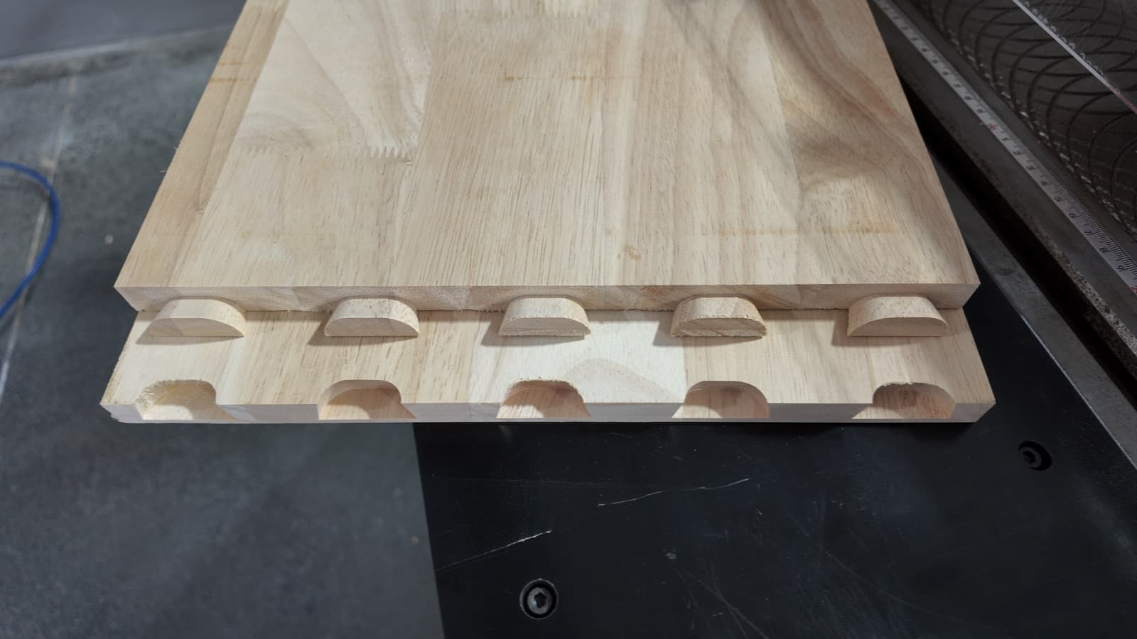 Sample panel showing five oversized dovetail joints, machined equally centered
