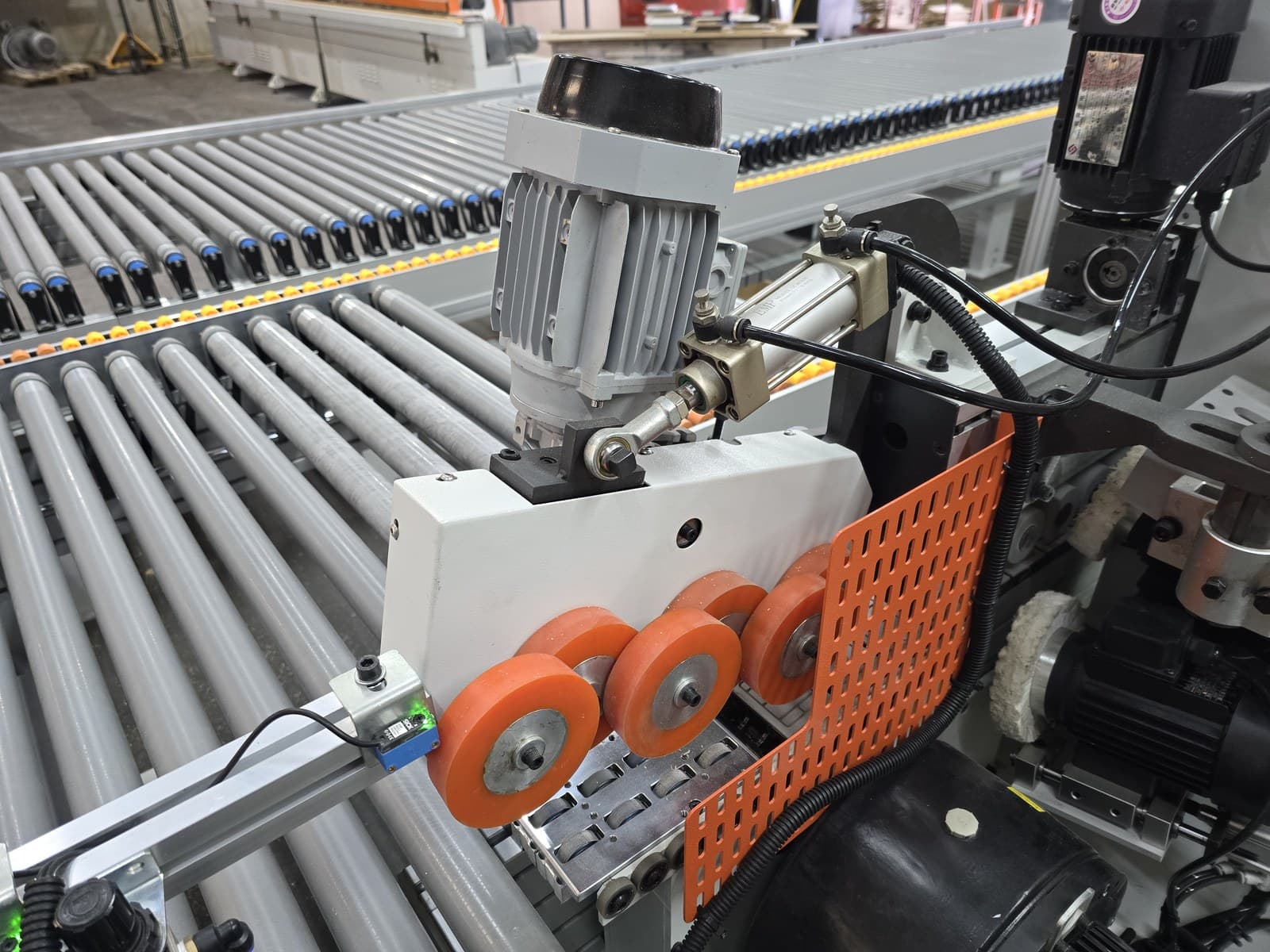 Outfeed drive motor with rollers and safety guard