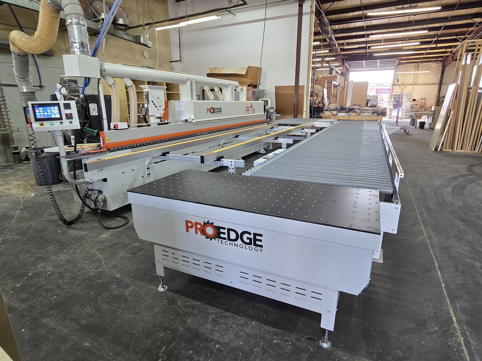 Outfeed receiving table at the edgebander outfeed with control screen in view