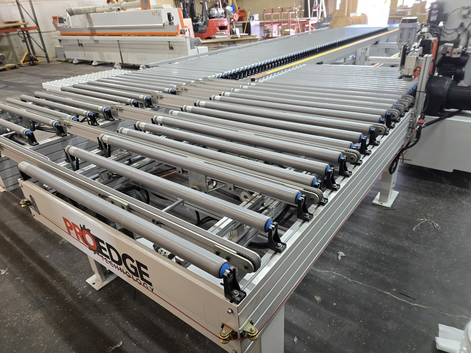 Receiving table rollers and transfer belts viewed from the corner