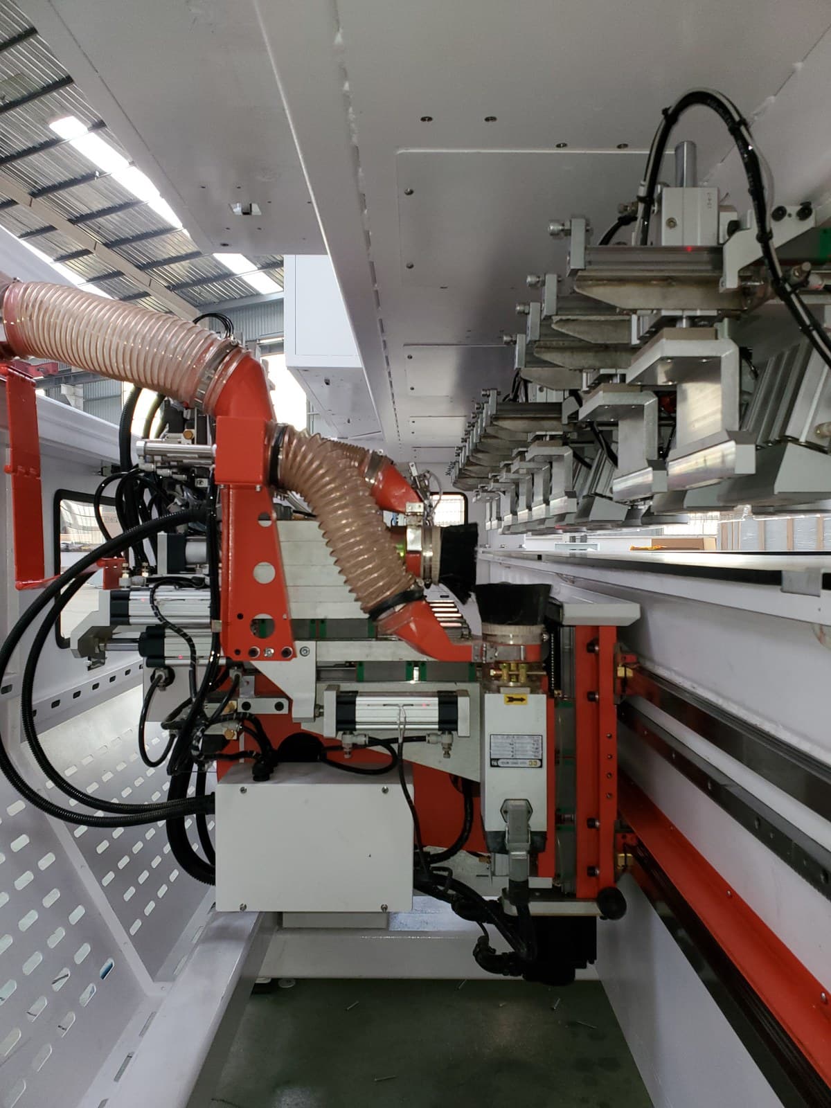 CNC routing platform with dust collection hose and spindle carriage