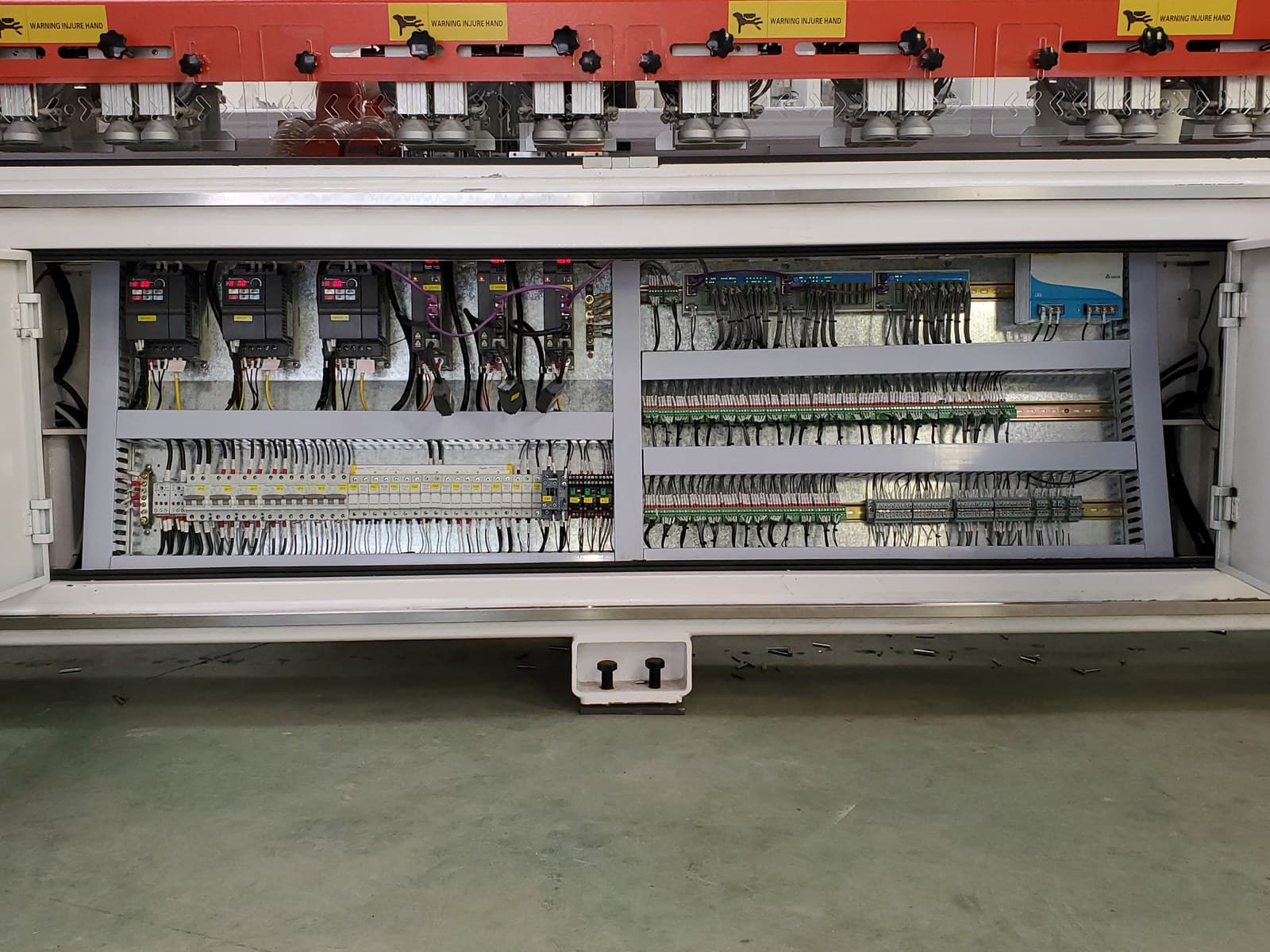 Close-up of main electrical cabinet wiring and terminal blocks