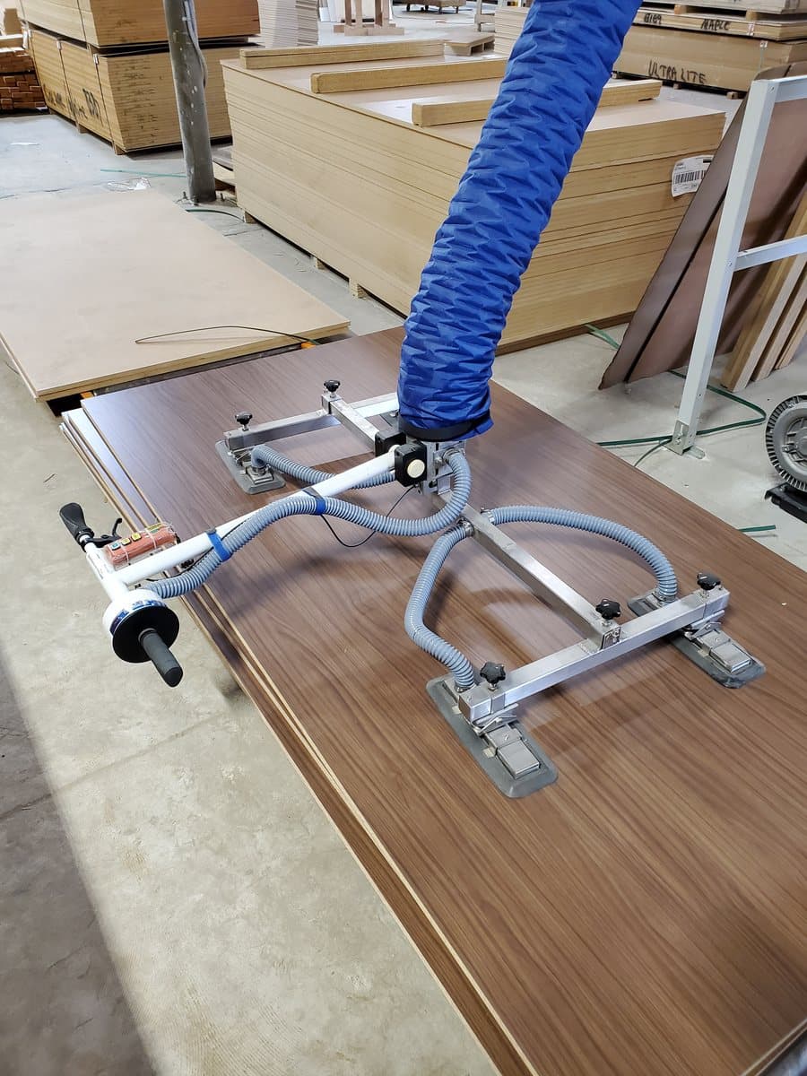 Material handling system moving a panel